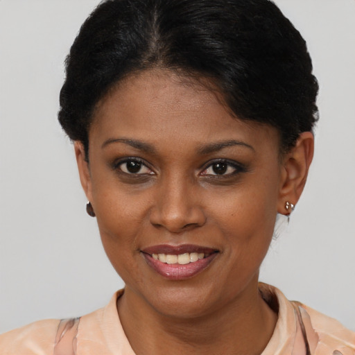 Joyful latino young-adult female with short  brown hair and brown eyes