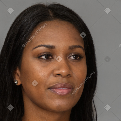 Joyful black young-adult female with long  brown hair and brown eyes