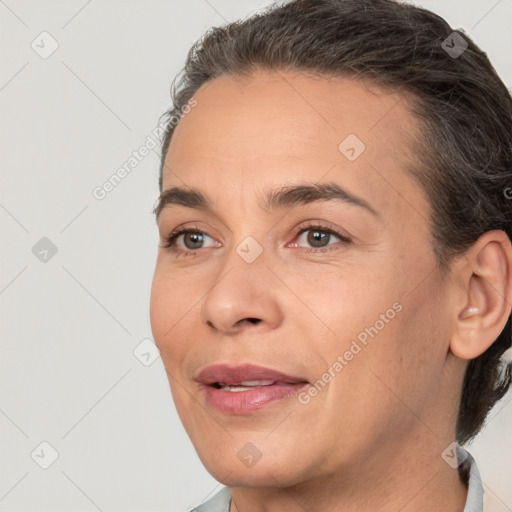 Joyful white adult female with short  brown hair and brown eyes