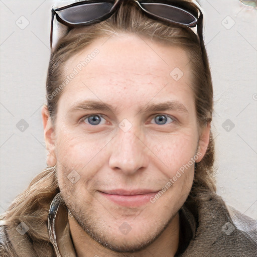 Joyful white adult male with short  brown hair and grey eyes