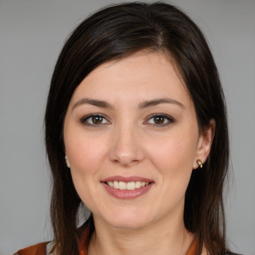 Joyful white young-adult female with medium  brown hair and brown eyes