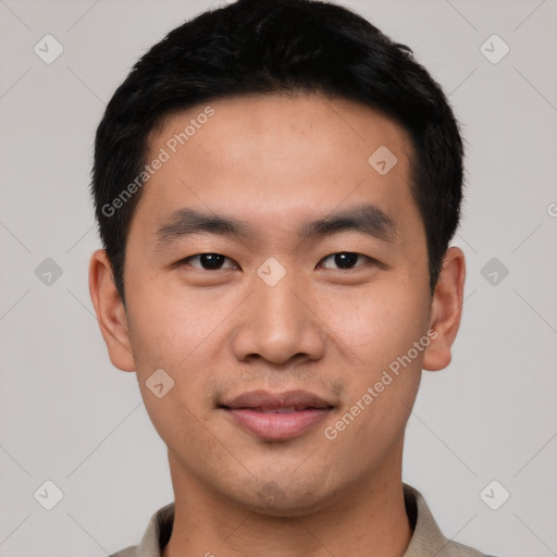 Joyful asian young-adult male with short  black hair and brown eyes