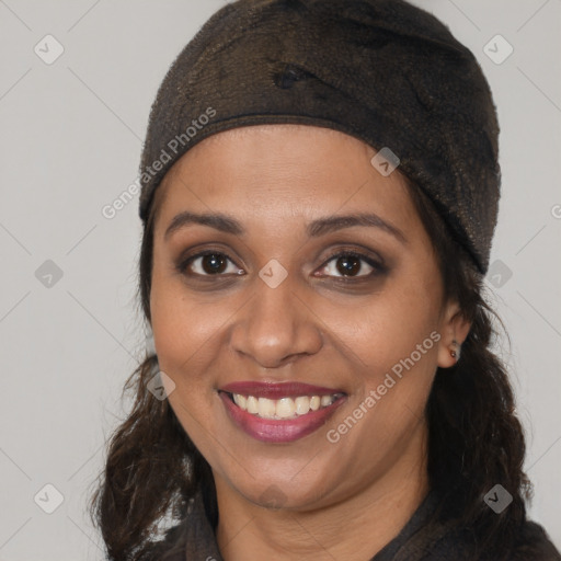 Joyful black young-adult female with long  brown hair and brown eyes