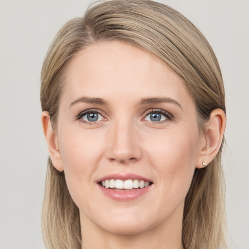 Joyful white young-adult female with long  brown hair and grey eyes