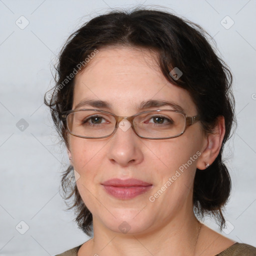 Joyful white adult female with medium  brown hair and brown eyes