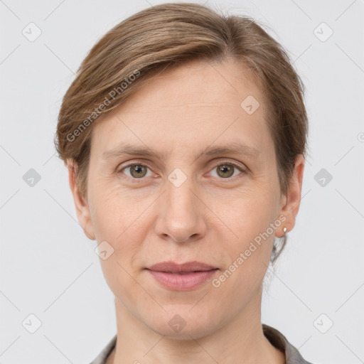 Joyful white adult female with short  brown hair and grey eyes