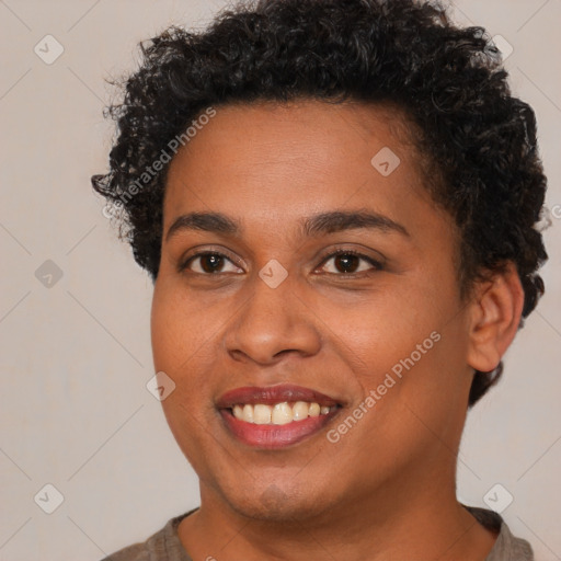 Joyful black young-adult female with short  brown hair and brown eyes