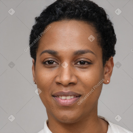 Joyful black young-adult female with short  black hair and brown eyes