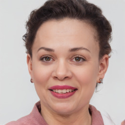 Joyful white adult female with short  brown hair and brown eyes