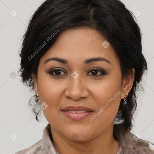 Joyful latino adult female with medium  brown hair and brown eyes