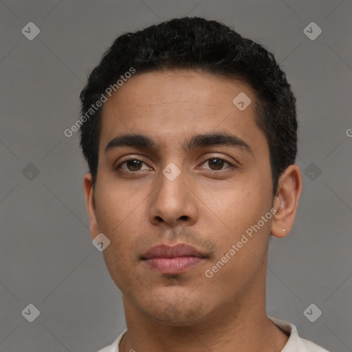 Neutral latino young-adult male with short  black hair and brown eyes