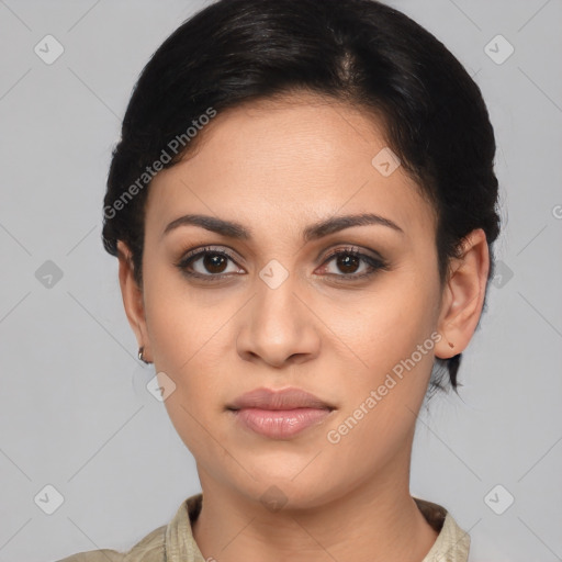 Joyful latino young-adult female with medium  black hair and brown eyes