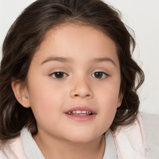 Joyful white child female with medium  brown hair and brown eyes