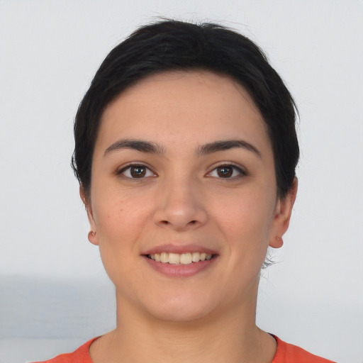 Joyful white young-adult female with short  brown hair and brown eyes