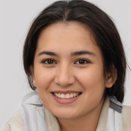 Joyful white young-adult female with medium  brown hair and brown eyes