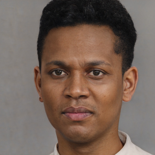 Neutral black young-adult male with short  black hair and brown eyes
