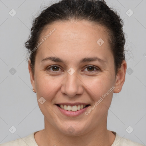 Joyful white adult female with short  brown hair and brown eyes