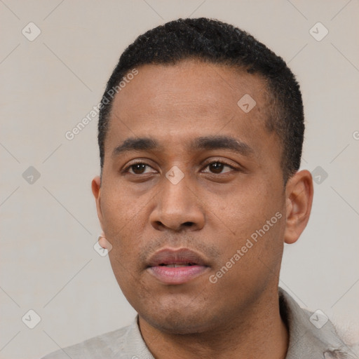 Neutral latino young-adult male with short  black hair and brown eyes
