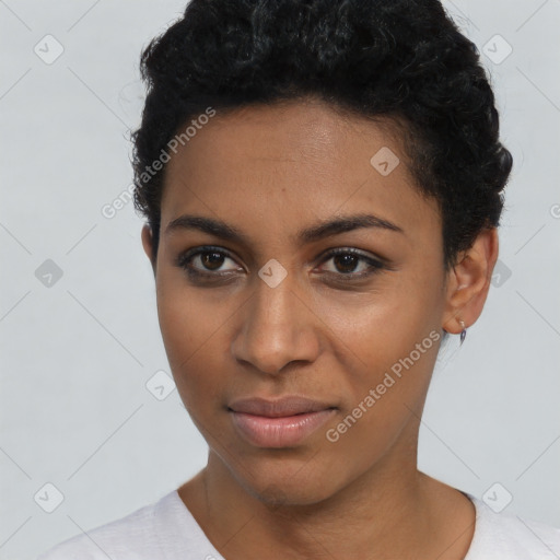 Joyful black young-adult female with short  black hair and brown eyes