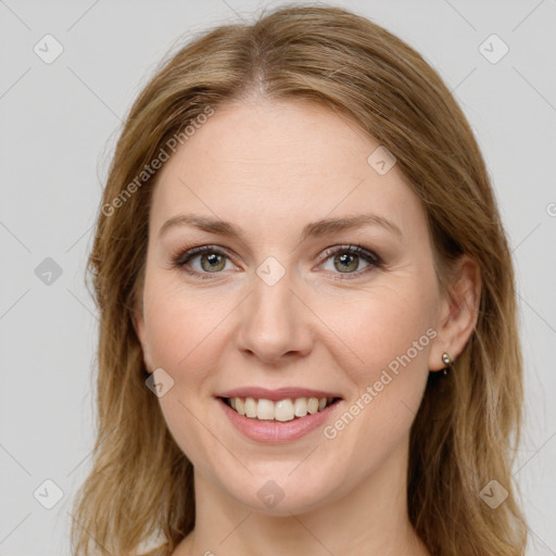 Joyful white young-adult female with long  brown hair and green eyes