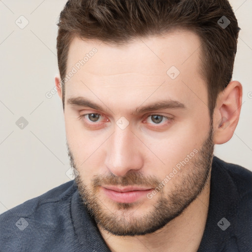 Neutral white young-adult male with short  brown hair and brown eyes