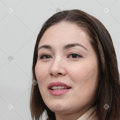 Joyful white young-adult female with long  brown hair and brown eyes