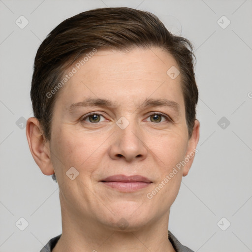 Joyful white adult female with short  brown hair and grey eyes