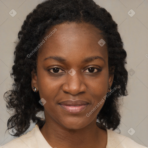 Joyful black young-adult female with medium  brown hair and brown eyes