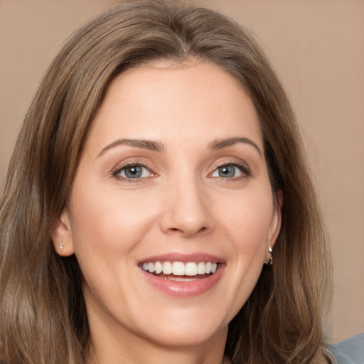 Joyful white young-adult female with long  brown hair and brown eyes