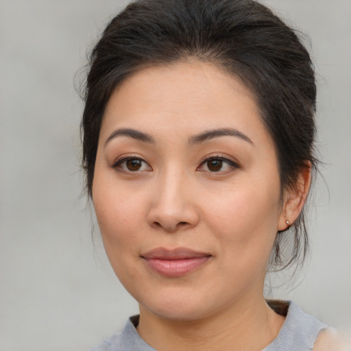 Joyful white young-adult female with medium  brown hair and brown eyes