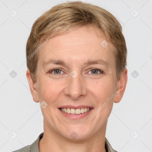 Joyful white adult female with short  brown hair and grey eyes