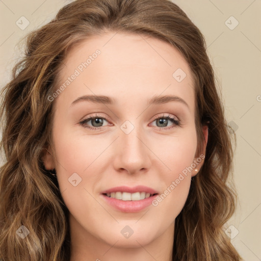 Joyful white young-adult female with long  brown hair and green eyes