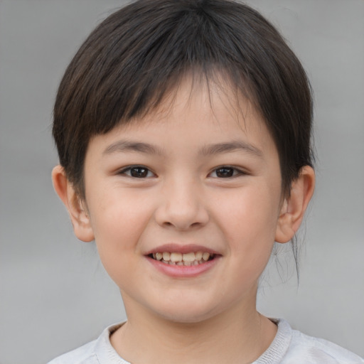 Joyful white child female with short  brown hair and brown eyes