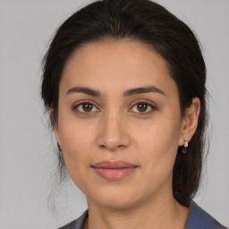 Joyful white young-adult female with medium  brown hair and brown eyes