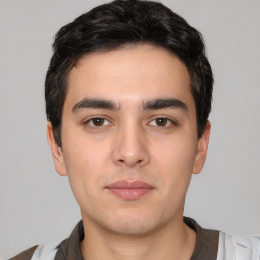 Neutral white young-adult male with short  black hair and brown eyes