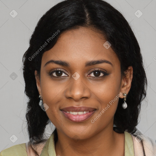 Joyful black young-adult female with long  black hair and brown eyes