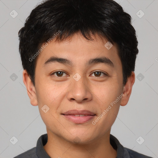 Joyful asian young-adult male with short  brown hair and brown eyes