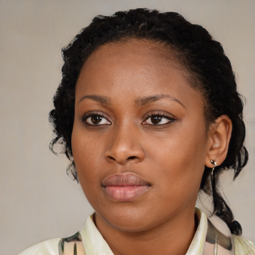 Neutral black young-adult female with medium  brown hair and brown eyes