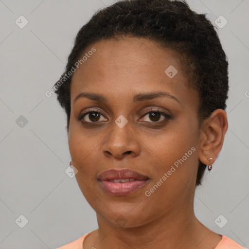 Joyful black young-adult female with short  brown hair and brown eyes