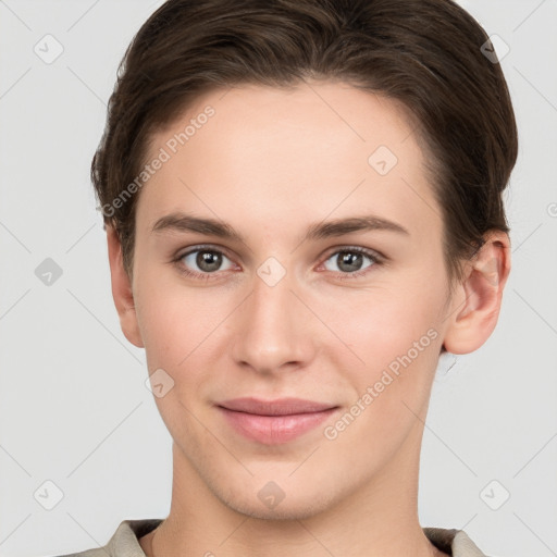 Joyful white young-adult female with short  brown hair and grey eyes