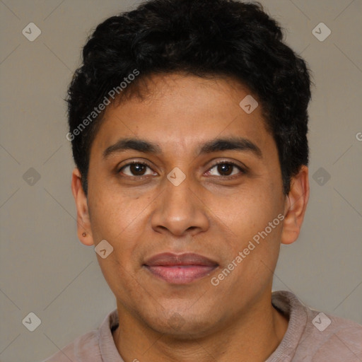 Joyful latino young-adult male with short  brown hair and brown eyes