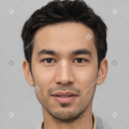 Joyful white young-adult male with short  black hair and brown eyes