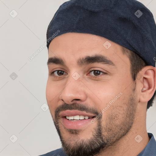 Joyful white young-adult male with short  black hair and brown eyes