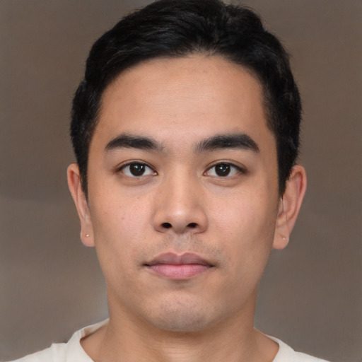 Neutral white young-adult male with short  black hair and brown eyes