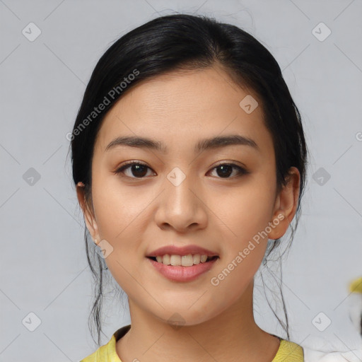 Joyful asian young-adult female with medium  black hair and brown eyes