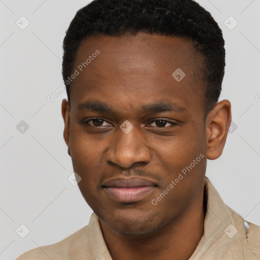 Joyful black young-adult male with short  brown hair and brown eyes