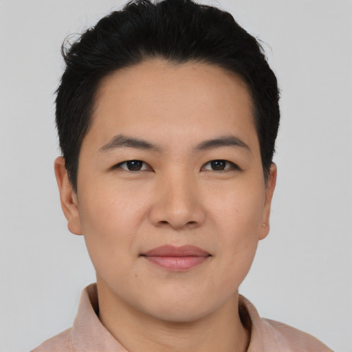 Joyful asian young-adult male with short  black hair and brown eyes