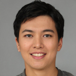 Joyful asian young-adult male with short  black hair and brown eyes