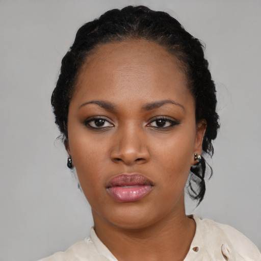Neutral black young-adult female with medium  black hair and brown eyes
