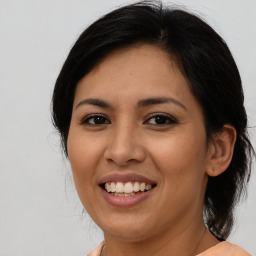 Joyful asian young-adult female with medium  brown hair and brown eyes